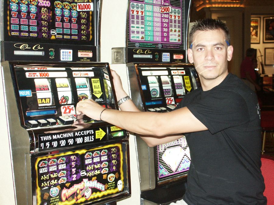 Pat playing the slot machines